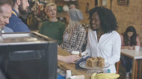 Customers placing order and making payment at counter of coffee shop Video stock 108024514