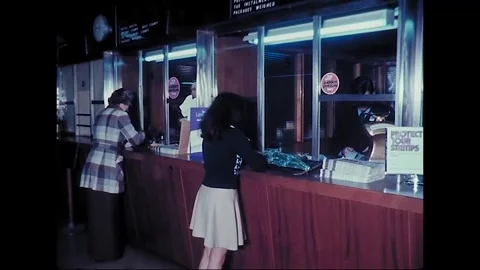 Customers Queue at Australian Post Office Counter, 1977 스톡 동영상 338383819