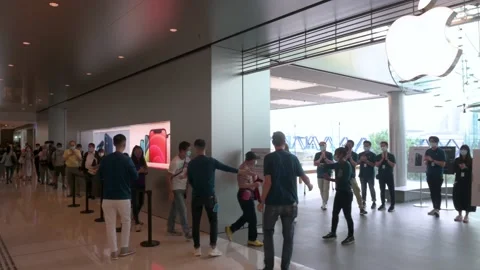 Customers queue in line as the Apple store opens to the public during the Video stock 142092991