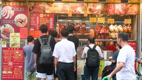 Customers Queue for Siu Mei (HK Barbeque) Takeaway Lunch Boxes on Bustling Hong Stock Footage 306922313