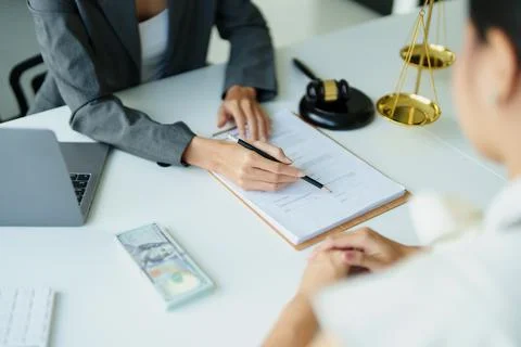 Customers read important documents before signing signatures. Stock Photos