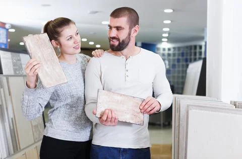 Customers with sample of ceramic tile Stock Photos