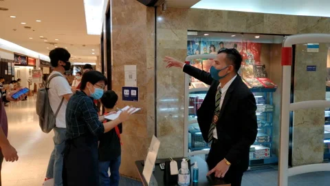 Customers Scan QR Code For Contact Tracing of Coronavirus Pandemic in Mall Stock Footage 130564368
