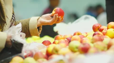 Customers select apples in supermarket Stock Footage 21248146