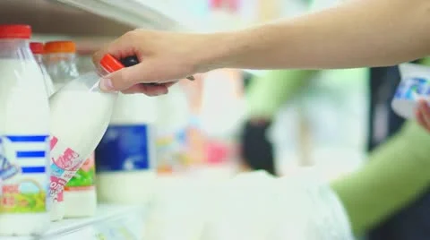 Customers select milk in supermarket Stock Footage 11991019