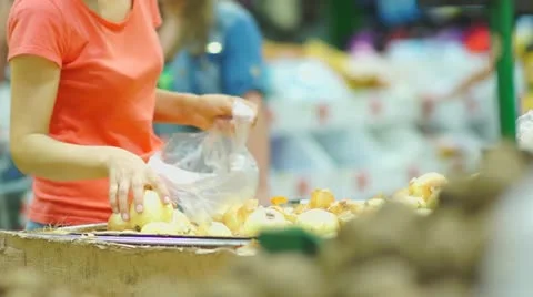 Customers select onion in supermarket Stock Footage 11986203