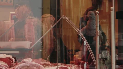 Customers shop inside a local butcher shop Stock Footage 344732321