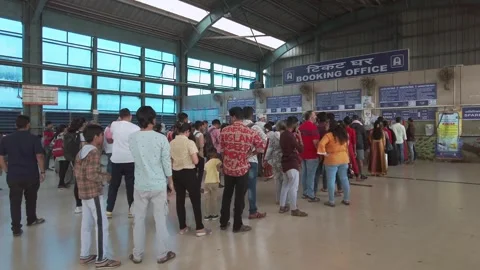 Customers at the ticket office inside the Andheri Railway Station in Mumbai Stock Footage 292141180