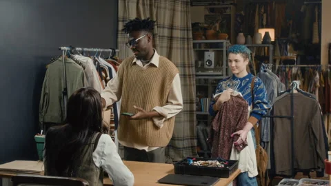 Customers Waiting to Pay for Secondhand Clothes in Thrift Store Stock Footage 328369436