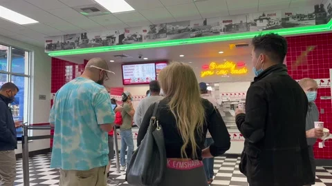 Customers Waiting for Their Orders at a Fast Food Restaurant Video stock 163750466