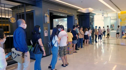 Customers Wearing Face Masks Lined up To Enter Store in Bangkok, Thailand  Stock Footage 130606762
