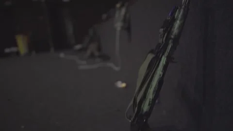 Customized AK-74 with Suppressor in Dark Staging Area Stockbeeldmateriaal 333382028
