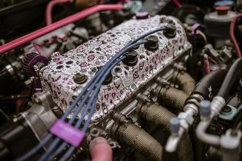Customized car engine showing sugar skulls pattern and colorful cables Stock Photos