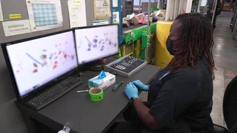 Customs Border Protection officer checking x-rayed incoming parcels on monitor 스톡 동영상 291102182