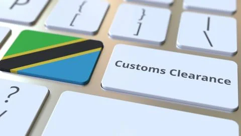 CUSTOMS CLEARANCE text and flag of Tanzania on the buttons on the computer Stock Illustration