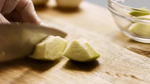 Cut the apple and clean it. 4k cinematography video recipe Stock Footage 156445705