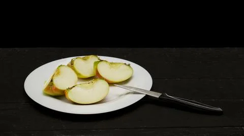 Cut Apple on a black background on a Table 스톡 사진