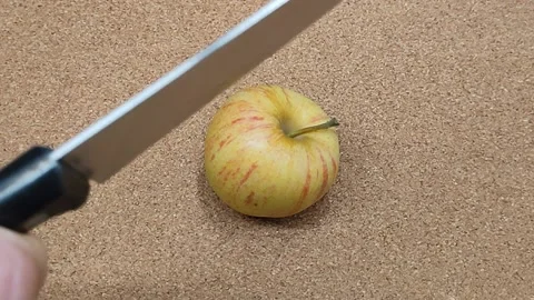 Cut the apple in half Stock Footage 167934080