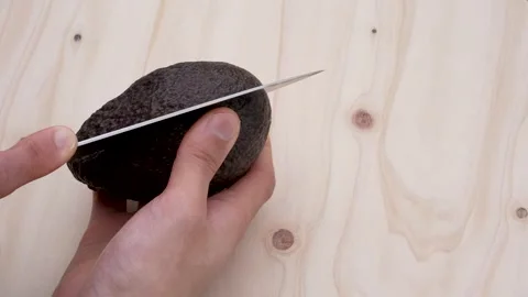 Cut avocado in half. Stock Footage 301668302