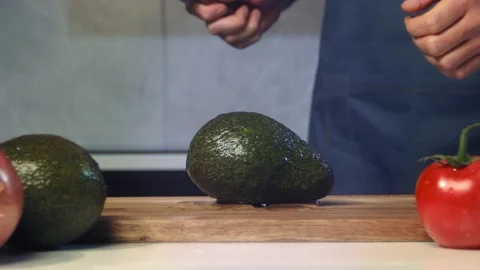 Cut avocado slow motion Stock Footage 170660385