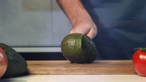 Cut avocado slow motion Stock Footage 170660400