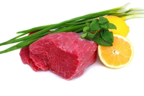 Cut of  beef steak  with lemon slice and onion. Stock Photos