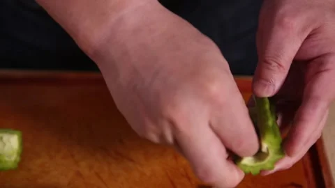 Cut bitter gourd with a kitchen knife to remove the pulp of bitter gourd (4) Stock Footage 202157064