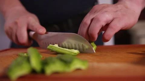 Cut bitter gourd with a kitchen knife to remove the pulp of bitter gourd (1) Stock Footage 202158395