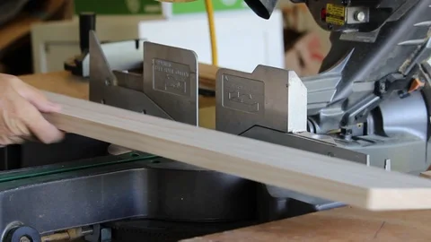 Cut board on Compound Miter Saw Stock Footage 108278531