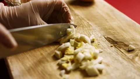 Cut boiled eggs for salad. Ingredients Ladie's Caprice Salad in form of Ananas Stock Footage 156714856