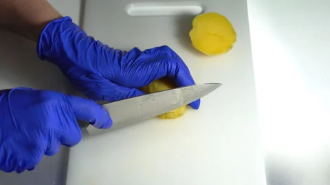 Cut boiled potatoes with a knife Stock Footage 300477979