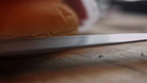 Cut the bread for the burger. Taste Classic American burger. 4k video Vidéo 159597225