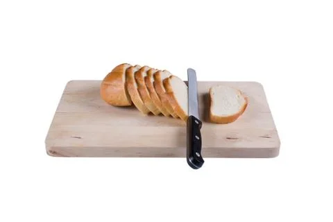 The cut bread on a chopping board. Stock Photos