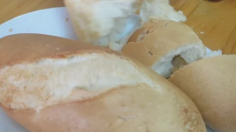 Cut bread at dinner Stock Footage 70688174