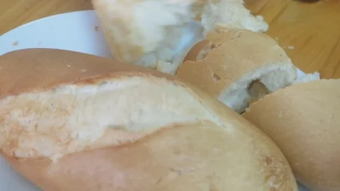 Cut bread with a knife Stock Footage 70687764