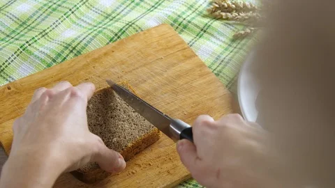 Cut the bread into small pieces. preparation of croutons Stock Footage 87732240
