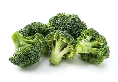 Cut broccoli placed on a white background Stock Photos