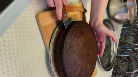 Cut a brown biscuit into cakes with a string knife. Stock Footage 167507057