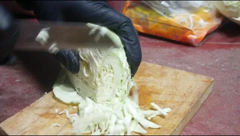 Cut the cabbage using a knife Stock Footage 313734514