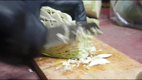 Cut the cabbage using a knife Stock Footage 313734515