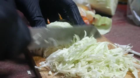 Cut the cabbage using a knife Stock Footage 313734534