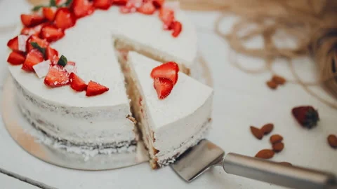 Cut the cake. Cake under the curd cream under strawberry. Stock Footage 86367963