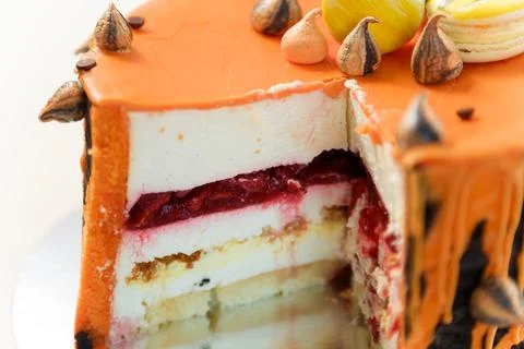 Cut cake with tiger stripes pattern and macaroons for man or boy. Sweets Stock Photos
