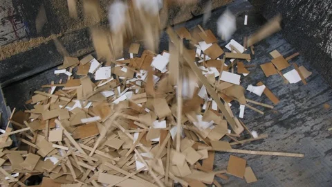 Cut cardboard falls down on conveyor at recycling workshop Stock Footage 111948494