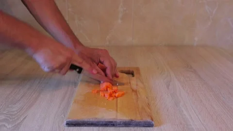 Cut the carrot into cubes. Video Stock Footage 158549072