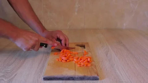 Cut the carrot into cubes. Video Stock Footage 158549075