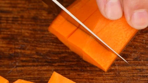Cut the carrots into cubes Stock Footage 84477811