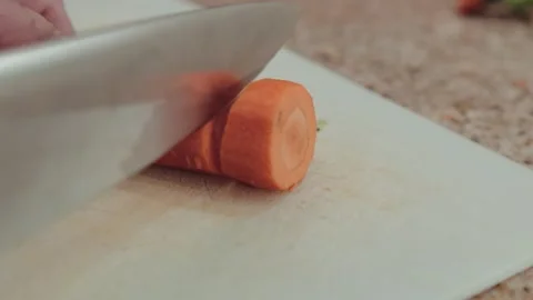 Cut carrots in slow motion Stock Footage 294444253
