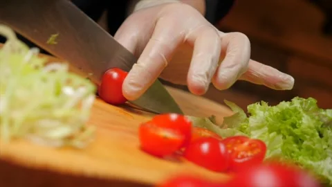 Cut cherry tomatoes with a knife. Stock Footage 148527309