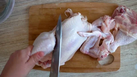 To cut a chicken carcass 4K Video stock 100521077